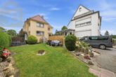 Außenansicht - Attraktives Mehrfamilienhaus mit 3 Wohneinheiten & 2 Garagen in Langenhagen! Mein Haus = Mein Makler