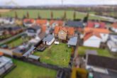 Hausansicht (hinten) - Gepflegtes Einfamilienhaus mit Garage & Garten in Woltwiesche! Meine Immobilie=Mein Makler!